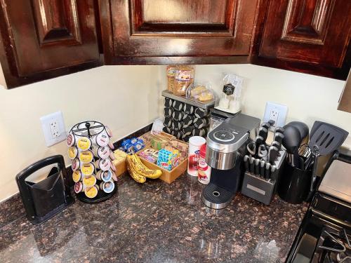 a kitchen counter with a counter top with various items on it at 3Mins.Airport/Fort Bliss-Pet Friendly-Washer/Dryer in El Paso