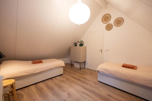Katil atau katil-katil dalam bilik di Vakantiehuis Vliegend Hert Veluwe