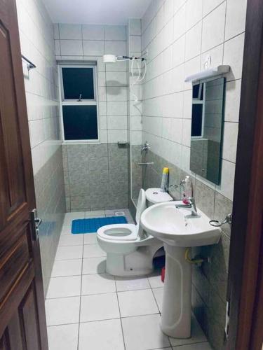 a bathroom with a toilet and a sink at Arabel 1 Bedroom D5 Kishan Towers, Nanyuki in Nanyuki