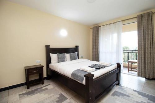 En eller flere senge i et værelse på Arabel 1 Bedroom D5 Kishan Towers, Nanyuki