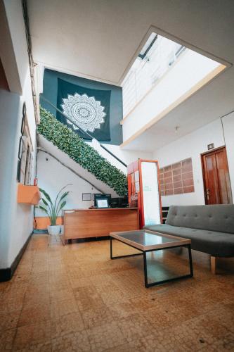 a living room with a couch and a table at Tequila Sunrise Hostel in Guatemala