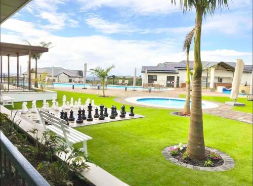 a large yard with a chess board in the grass at 362@BallitoHills in Ballito