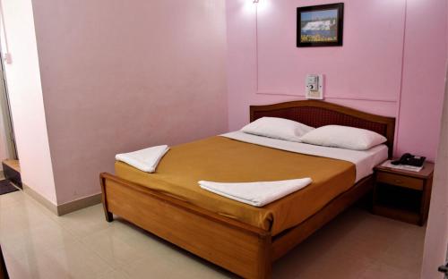 Ένα ή περισσότερα κρεβάτια σε δωμάτιο στο Margao Residency