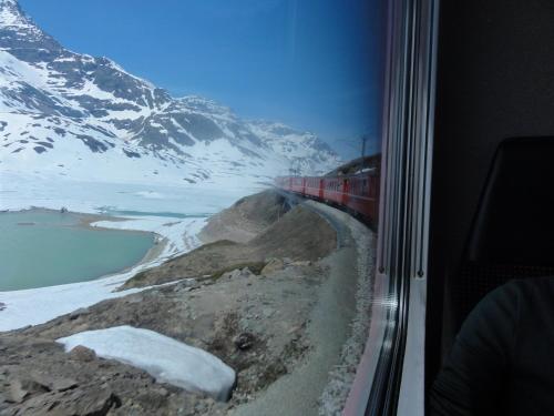 a train traveling through a snow covered mountain at Hotel Centrale Best Western Signature Collection in Tirano
