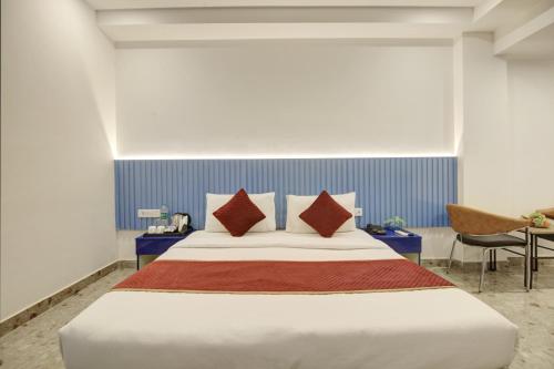 מיטה או מיטות בחדר ב-Hotel Elite 29 Golf Course Road