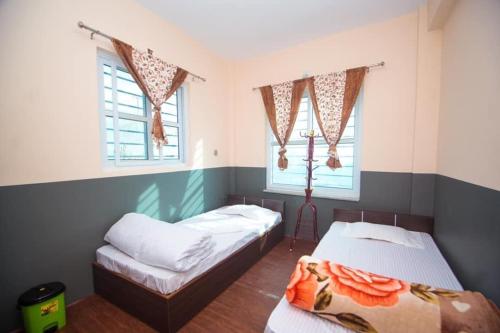 Postel nebo postele na pokoji v ubytování Ranimahal Homestay