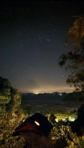 a starry night with a tent in the foreground at Hillhouse - Koh Yao Noi in Ko Yao Noi