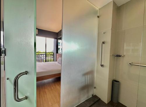 a door to a room with a bed and a bedroom at Azumi Boutique Hotel in Manila