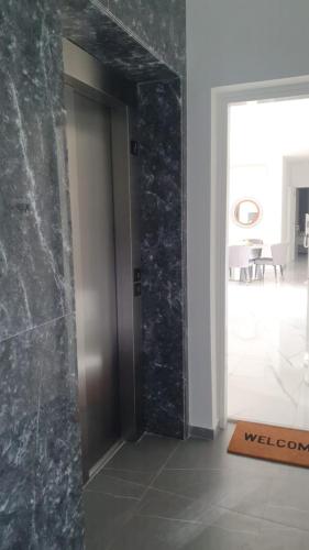 a hallway with a door to a room at Hypnos Residence in Nicosia