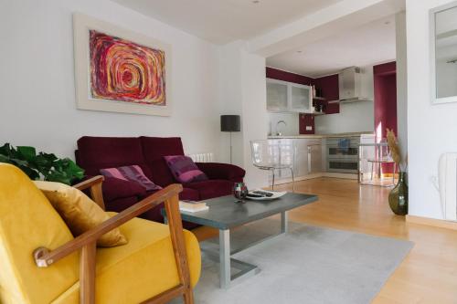 a living room with a couch and a table at Capricho de Zuheros in Zuheros