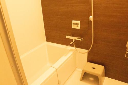 a small bathroom with a shower and a toilet at Mt Fuji View Villa Fujino Kirameki Fujigotemba in Gotemba