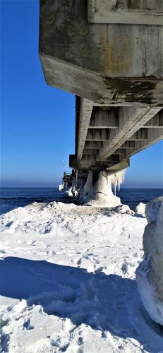 a bridge with snow on the ground under it at Hotel Meereswelle - Anno 1875 in Ahlbeck