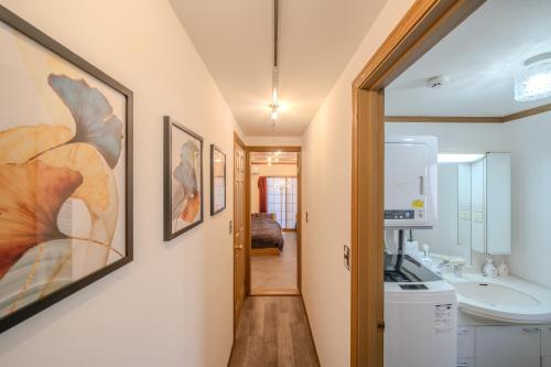 a bathroom with a sink and a mirror at 2 shower rooms #Shinjuku 5 min walk from station ,projector in Tokyo