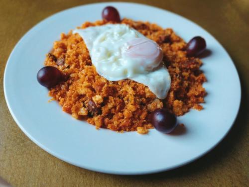 a plate of carrot cake with ice cream and beans at La Posada in Cantavieja