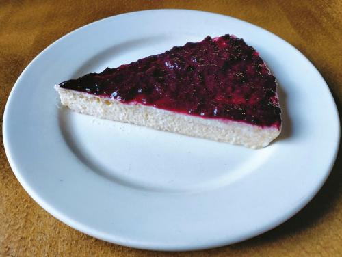a piece of cake on a white plate on a table at La Posada in Cantavieja