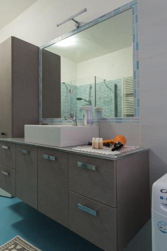 a bathroom with a sink and a mirror at Casa Sacchet a Longarone in Longarone