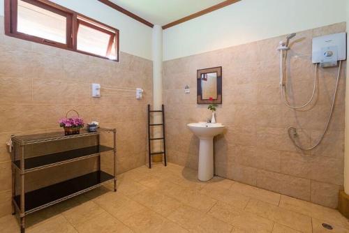 a bathroom with a shower and a sink and a toilet at Entire 5 beds Pool Villa on hill side. in Amphoe Koksamui