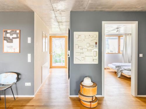 a living room with a bed and a table at FRIZ Holiday Apartments in Gundelfingen