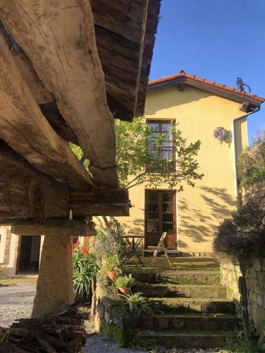 a house with a stone staircase in front of it at Casa Rural Trebol4Hojas in San Pedro
