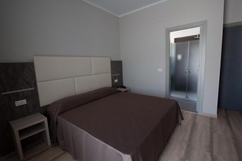 Ένα ή περισσότερα κρεβάτια σε δωμάτιο στο Hotel Europa