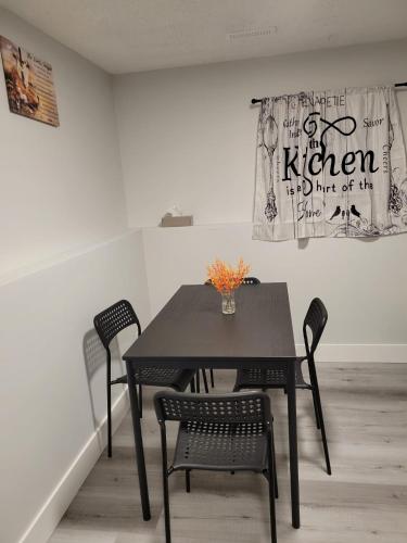 a black table and chairs in a room at Furnished Room-5 Close to U of A in Edmonton - with Shared Spaces in Edmonton