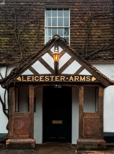 a building with a sign that saysleeiger arr amps at The Leicester Arms Country Inn in Penshurst