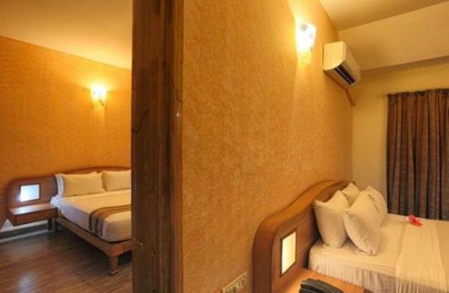 Cama o camas de una habitación en Calangute Residency