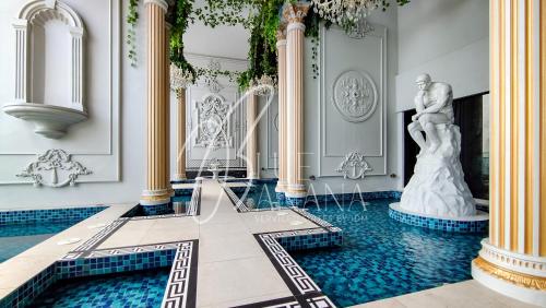 a room with a fountain and a statue of a woman at Arte Cheras by BlueBanana, Kuala Lumpur in Kuala Lumpur