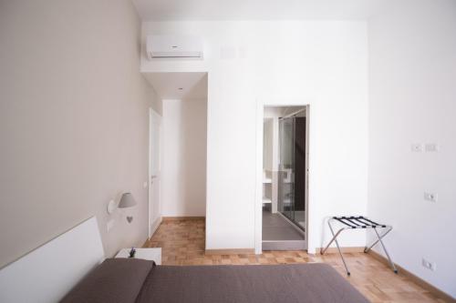 Postel nebo postele na pokoji v ubytování Vantaggio Apartment