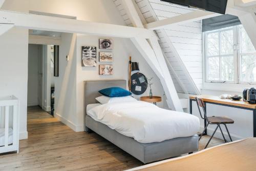 Postel nebo postele na pokoji v ubytování Eye Hotel