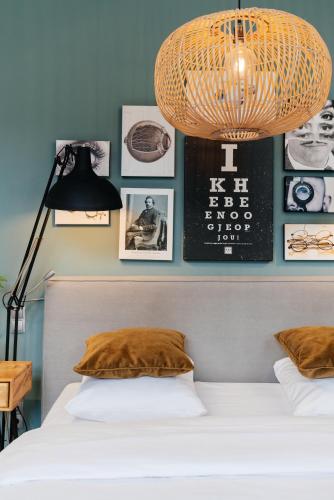 Postel nebo postele na pokoji v ubytování Eye Hotel