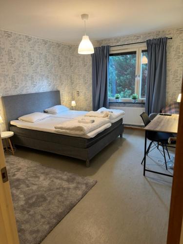 Ένα ή περισσότερα κρεβάτια σε δωμάτιο στο Workershotel Mariestad