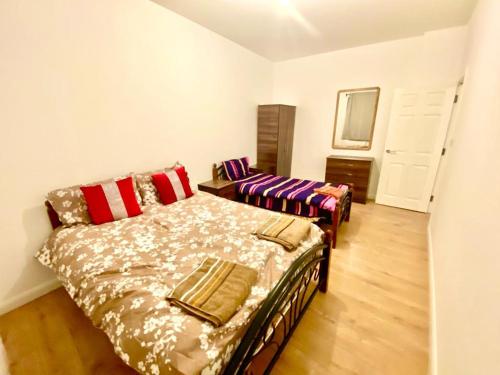 a living room with a bed and a couch at One Bedroom Apartment In Ealing London in Ealing