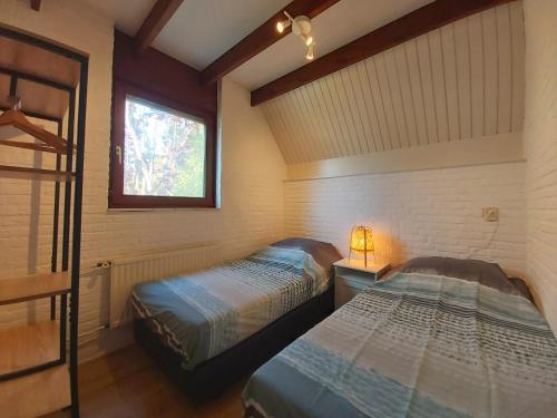 Postel nebo postele na pokoji v ubytování Luxe 6p vakantiehuis aan Strand & Grevelingenmeer!