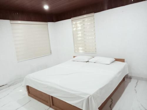 Ένα ή περισσότερα κρεβάτια σε δωμάτιο στο PETERCOTTAGE HOMESTAY