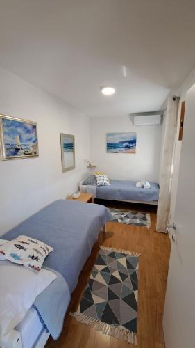 Posteľ alebo postele v izbe v ubytovaní Apartment Blue Pearl