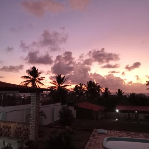 a sunset from the balcony of a house at Pousada Cruzeiro dos Anjos in Tabatinga