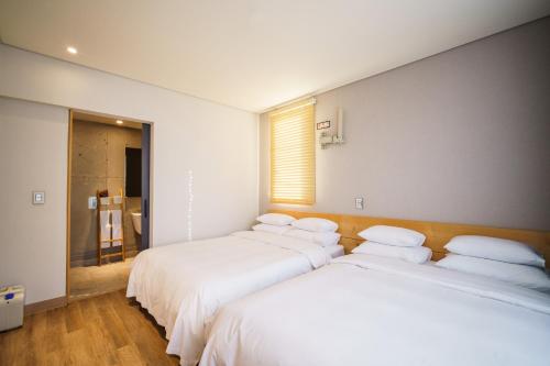 Ένα ή περισσότερα κρεβάτια σε δωμάτιο στο LACOZi STAY , Seoul