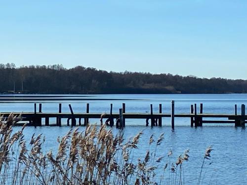 a dock on a large body of water at TiWu - Ferienwohnungen in Steinhude