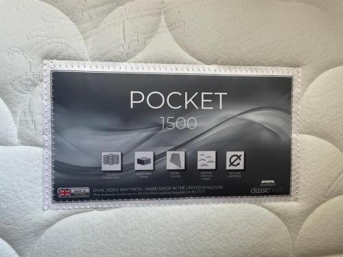 a box of rockett on a bed at Dinorwic Lodge in Liverpool