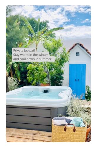 a bath tub with a sign that says private retreat stay warm in the winter at Casas das Piçarras - Alentejo in Piçarra