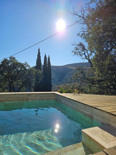a swimming pool with a view of the mountains at Mas del Roumany in Port-Vendres