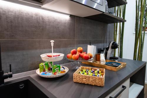 a kitchen counter with bowls of food on it at Guest House Al Viale in Caltagirone