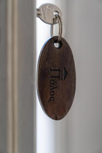 a key to a door with the word open on it at Palos Studios in Livadion
