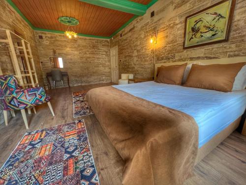 Una cama o camas en una habitación de Arton İn Cappadocia