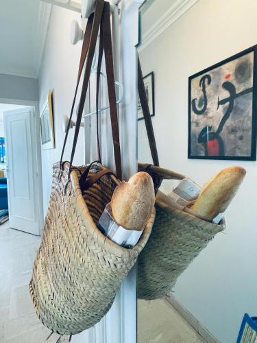 a basket hanging from a wall in a room at Luxury Apartment with amazing SEA view at Cap d'Antibes in Antibes