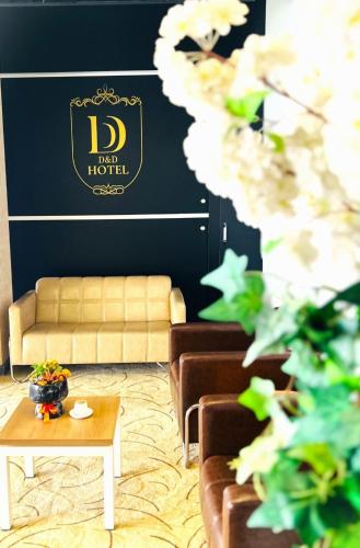 a living room with a couch and a table at D&D HOTEL in Nilüfer