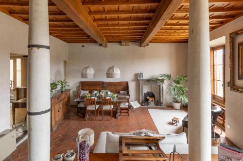 a living room with a couch and a table at Old Bridge large and unique artful apartment with elevator in Florence