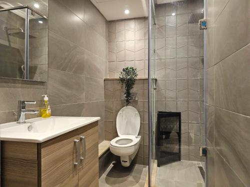 a bathroom with a toilet and a sink and a shower at Luxury Living 3 Bedroom Apartment with Beautiful Balcony Space, Casablanca in Casablanca
