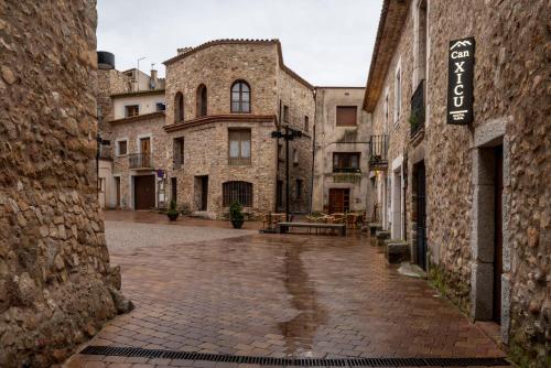 an empty street in an old stone building at Hostal Can Xicu in Capmany